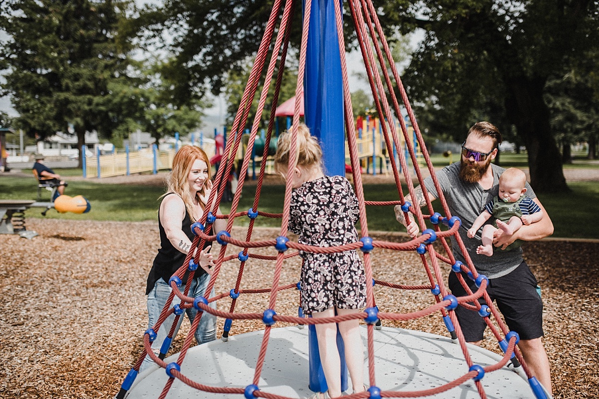 Skyleigh McCallum Realtor and Financial Educator plays with her family of four at a park in Kamloops, British Columbia