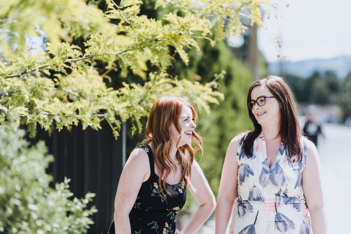 Kamloops Realtor Skyleigh McCallum walks with her sister in sunny Kamloops, BC.