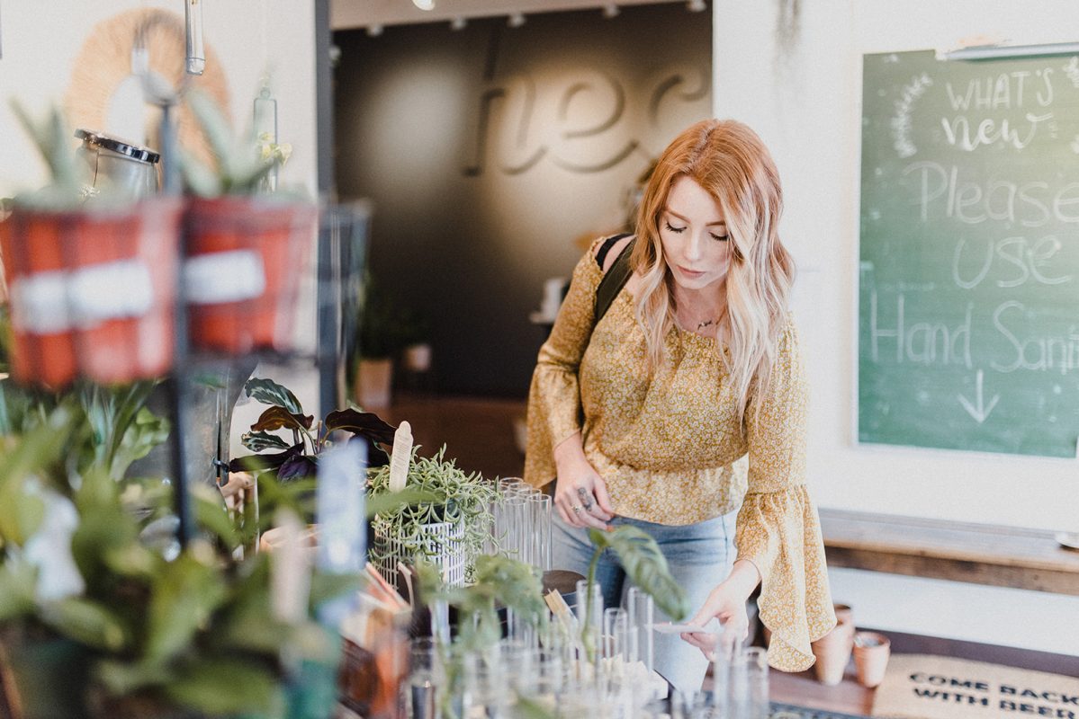 skyleigh mccallum kamloops realtor checks out the plant selection at far and wide store in kamloops bc