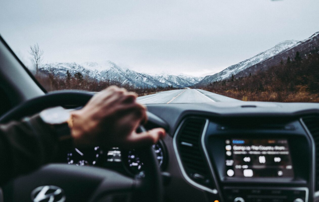 A Gen Z driving a new vehicle.