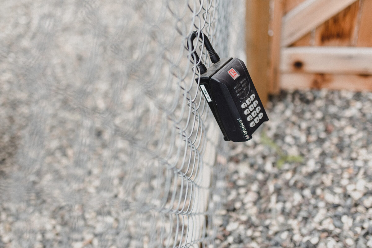 A key lock box on a chainlink fence waiting for Kamloops Realtor Skyleigh McCallum.