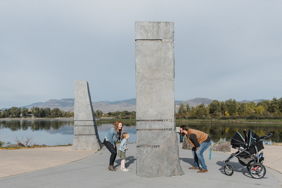 A Kamloops family enjoying a walk in a park downtown by the river, one of the many benefits of living in Kamloops.