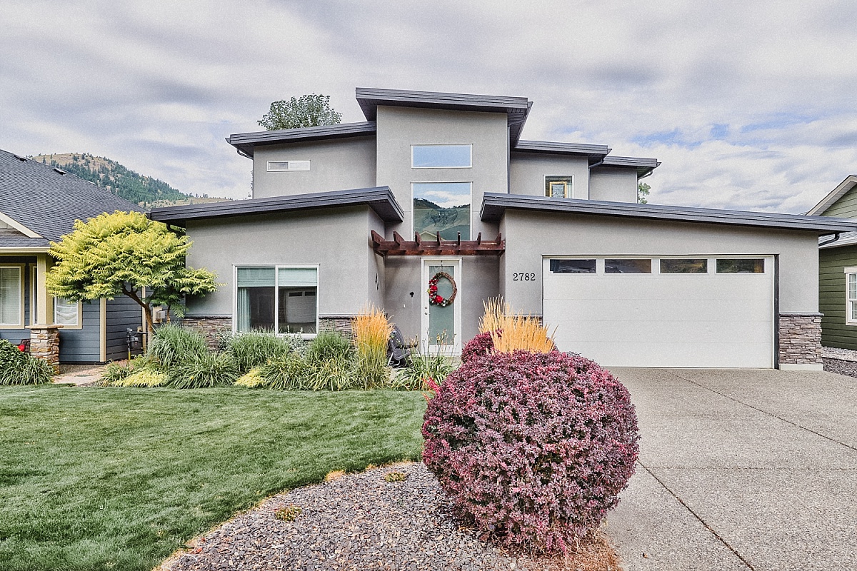 A beautiful home in Kamloops, British Columbia with modern architecture and a well-maintained garden.