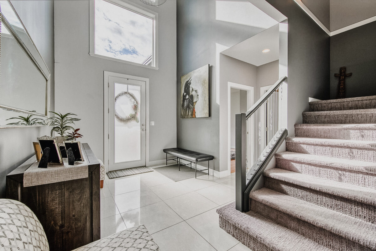 A big, bright, modern entryway in a beautiful home in Kamloops, British Columbia.