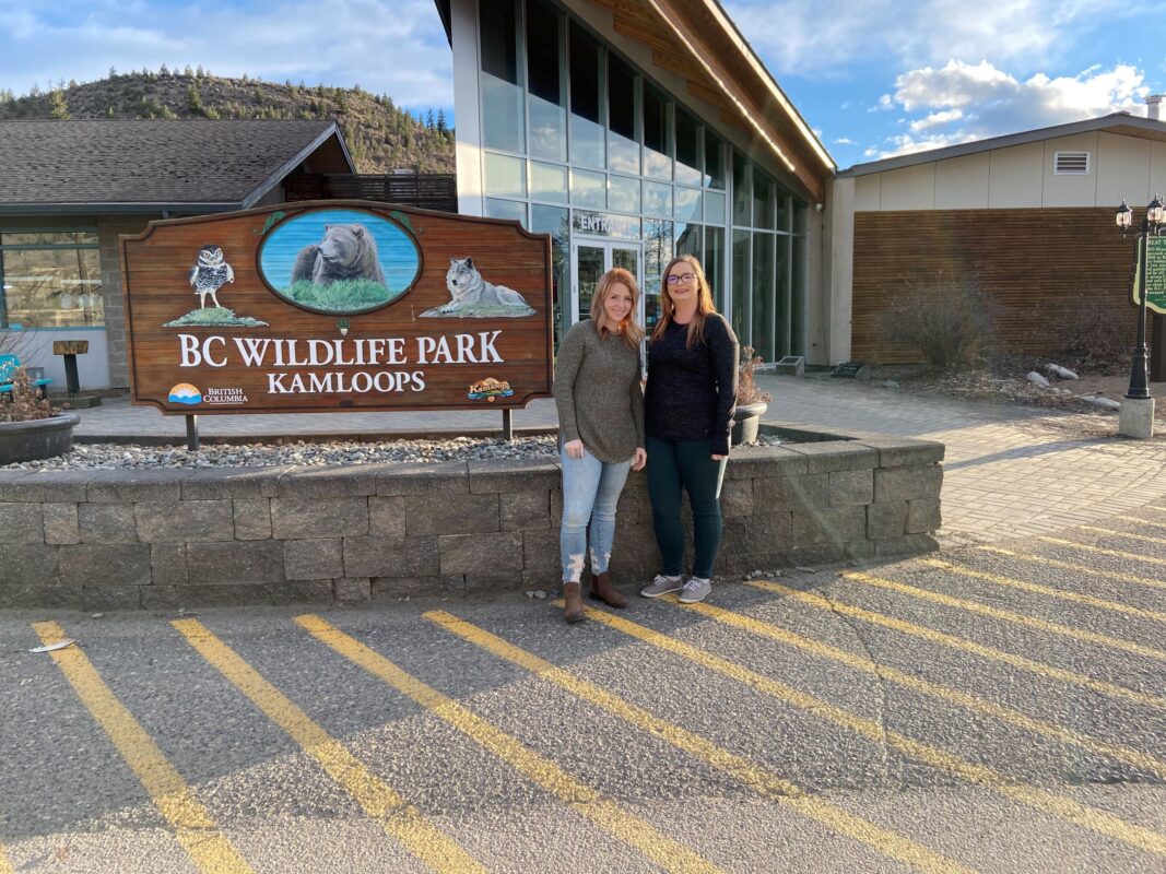 Skyleigh McCallum and her sister, Alicia McCallum, standing in front of the BC Wildlife Park in Kamloops.