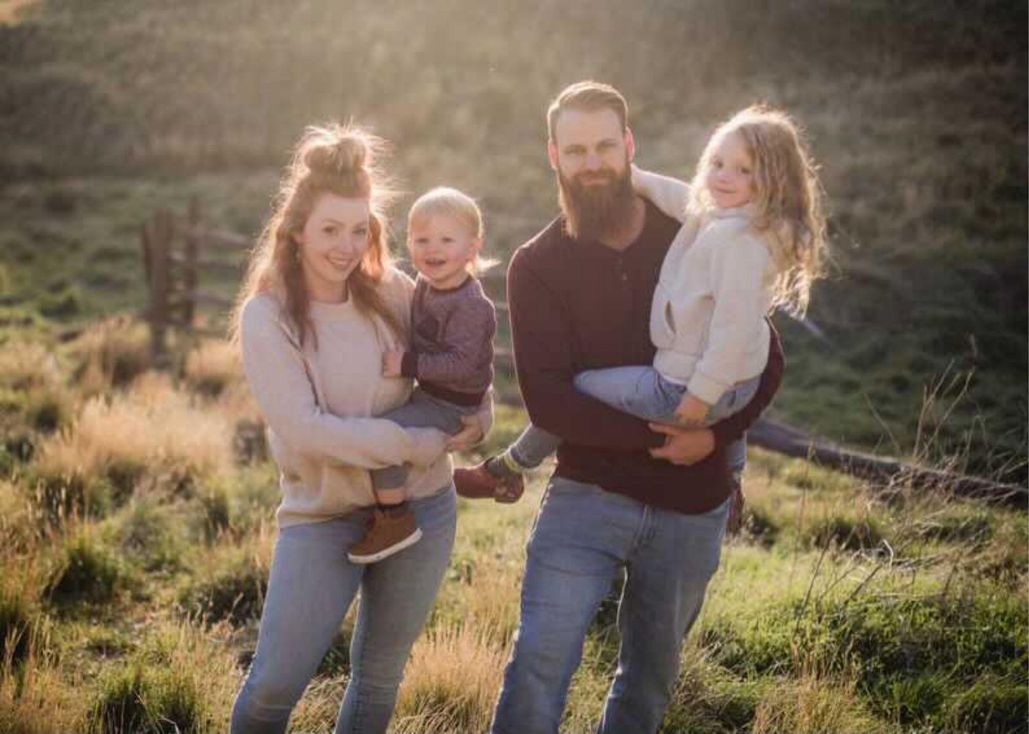 Skyleigh holding her son while her partner holds their daughter during a family photoshoot